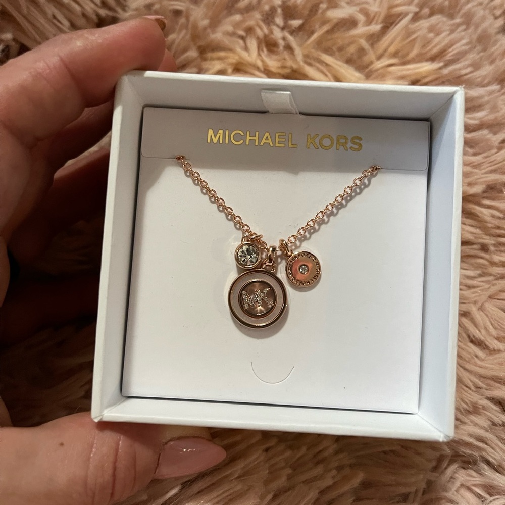 Brand new rose gold toned diamond accent MK necklace